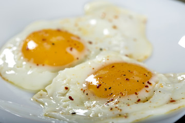 Two eggs with pepper and dried hot chilli