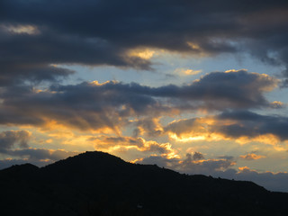 Dawn clouds over hills