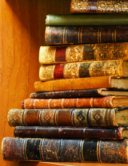 Stack of antique books on shelf