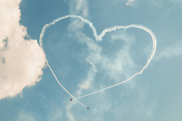 Immersion heart-shaped trace made in sky by Yak-52
