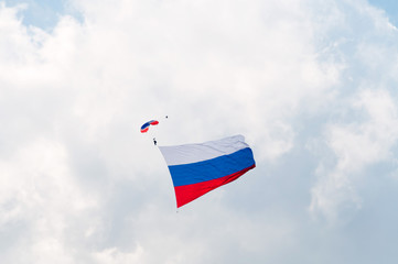 Landing of paratrooper with giant Russian national flag