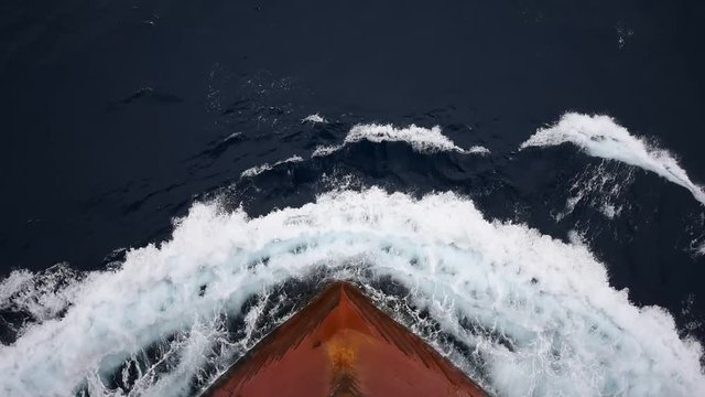 Large Bulk Carrier Ship Moving in the Ocean. Point of View Bulbous Bow.