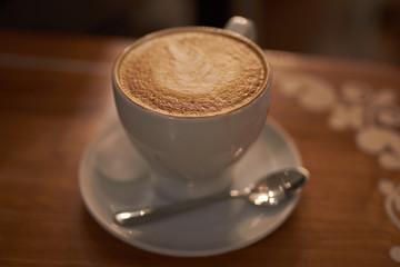 A cappuccino in a bowl with latte art 