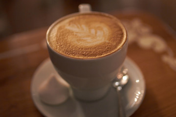 A cappuccino in a bowl with latte art 