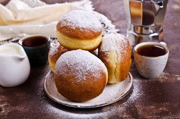 Traditional donuts with powdered sugar