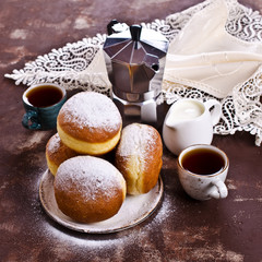 Traditional donuts with powdered sugar