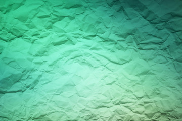 Green texture crumpled textured faded colors on a sheet of paper