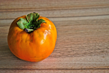 Persimmon on a wooden table