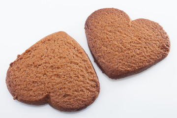 Gingerbreads on white background with reflection.