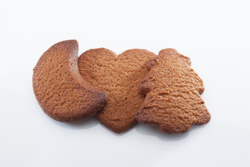 Gingerbreads on white background with reflection.