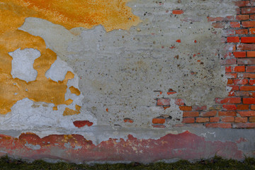 Old brick wall texture. Masonry background. Masonry texture. Brickwork with old bricks, deciduous plaster and pieces of mortar. Variegated run-down wall. Squalid bricken face. Shabby bricking sheet
