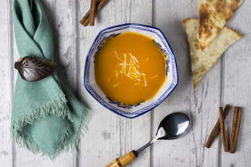 Homemade soup on wooden table, top view