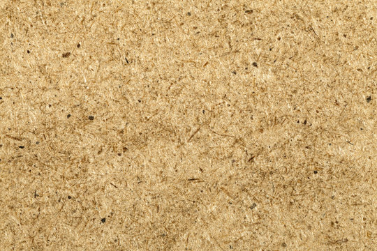Hardboard sheet front side background image. Hardboard pattern backdrop. Fiber board sheet front side texture. Fiberboard surface texture closeup shot. Fiberboard front wallpaper.