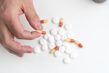 Medication capsule in hand
