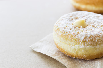 closeup donut on paper texture with warm fall colors, soft-focus in the background. over light
