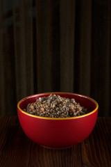 Buckwheat porridge on wooden background