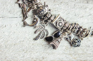 bracelet with pendants charms on the summer theme. Selective focus. 