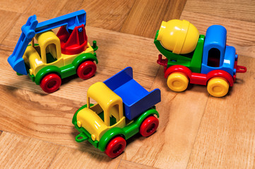 Fototapeta premium three plastic toy cars