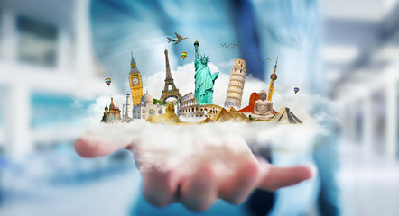 Businessman holding a cloud full of famous monuments in his hand