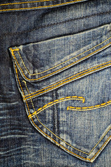 Pocket of a blue jeans.  Fabric background