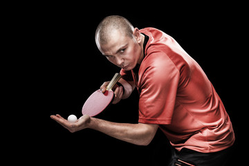 Portrait of sports man, male, athlete playing table tennis isolated on black background
