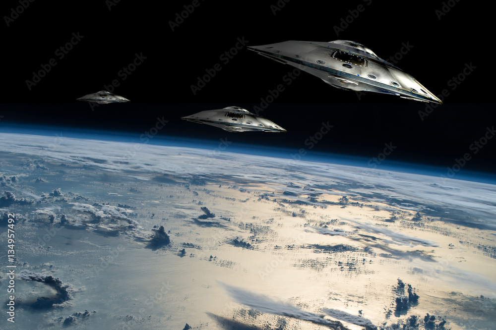 Canvas Prints a fleet of flying saucers approach earth - elements of this image furnished by nasa.