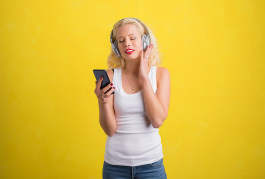 Woman listening to music on wireless headphones