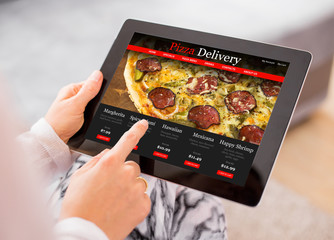 Woman ordering pizza online © Kaspars Grinvalds