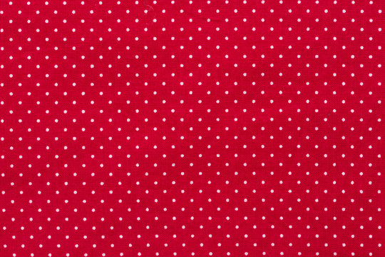 Polka dot on red canvas cotton texture, fabric background