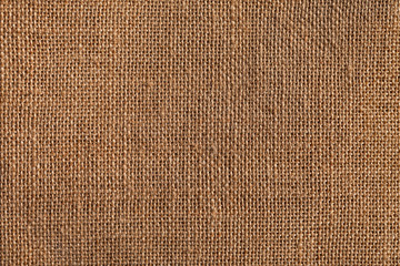 Wovened gunny texture. Woven fabric material. Old textile wallpaper. Au naturel material background image. Natural fabric brown texture.
