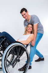 Obraz premium disabled woman in wheelchair and his wife