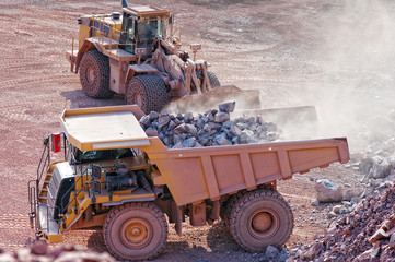 View into a quarry mine. earth mover loading dumper truck with r © lcrms