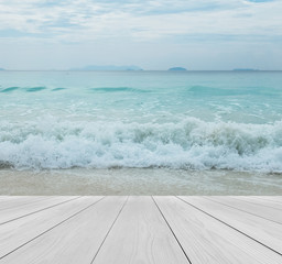 Fototapeta premium Wood Terrace on The Beach with Clear Sky, Crystal Clear Sea and Big Island in Myanmar in Scenery Background for Mock up to Display Product or input Text