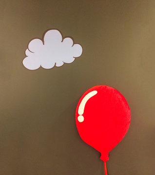 One 3d Red Soft Fluffy Pillow in Shiny Red Balloon Design Style Floating at The Corner with White Cloud and Copyspace on Abstract Dark Brown Wall to input Text