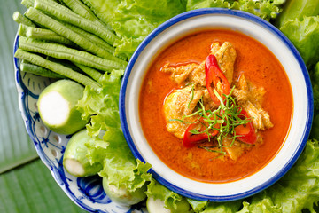 Chicken panang curry and vegetables in the tile dish