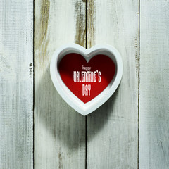 Valentine's Day card with hearts on old wooden background