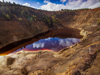 The red lake by the mines with reflections