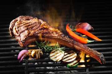 Fotobehang Tomahawk rib beef steak on grill © Alexander Raths