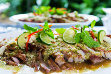 Thai cuisine Grill Spicy Pork Salad on plate