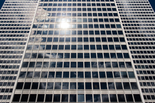 Uplifting Point of view of Financial Buildings reflecting clouds