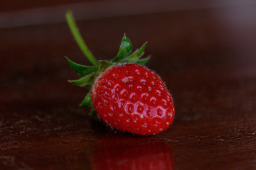 Fresh strawberries on old table wood