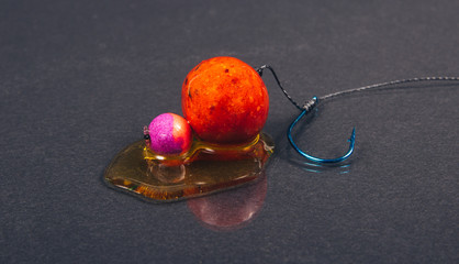 Carp hook boilies with dip . CloseUp .