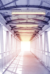 Light from the way out of modern metal structure bridge