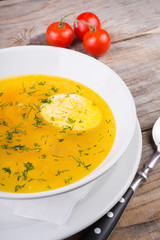 Yellow soup with egg