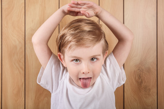 Little boy sticking his tongue out
