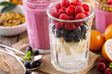 Berry smoothie ingredients in tall glass