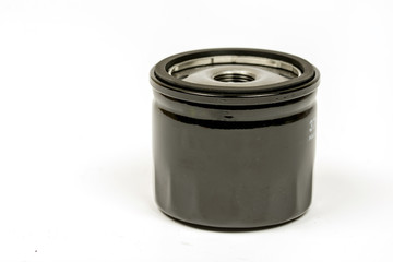 Black metal car oil filter isolated over white background