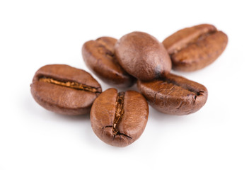 roasted coffee beans isolated in white background. Roasted coffee beans background close up. Coffee beans pile from top on white background with copy space for text. Good morning.