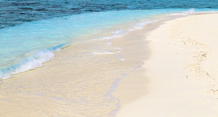 Soft wave at tropical sand beach island, Maldives