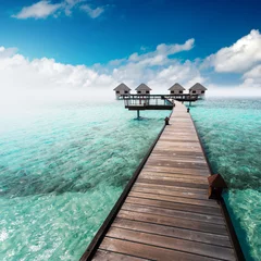 Fotobehang Water bungalows resort at islands. Indian Ocean, Maldives © Ivan Kurmyshov